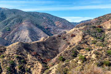 Burned hillsides in California mountains on early autumn morning