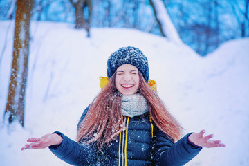 Fototapeta na wymiar Portrait of young beautiful woman in the deep snow. (holidays, new year, christmas, celebration concept)