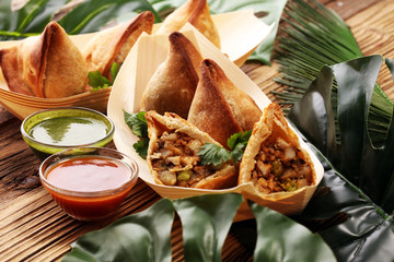Vegetarian samsa or samosas.Indian special traditional street food punjabi samosa or Coxinha,...