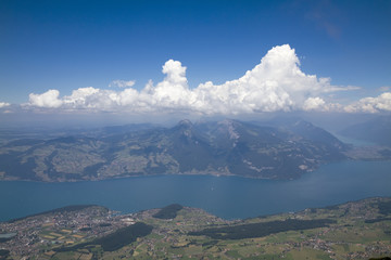 Fototapeta na wymiar Panorama of Lake Thun and the Bernese Alps from Mount Nisen