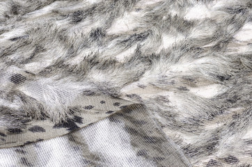 Knitted fabric with fringe of white-brown color