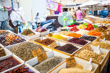 SYRACUSE, ITALY - MAY 04th, 2018: this traditional almonds and pistachios market is one of the most colourful in all Sicily.