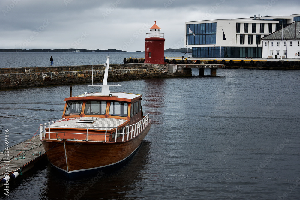 Wall mural Alesund town and port, renowned for its beautiful Art Nouveau buildings. Lighthouse in Alesund , Norway.