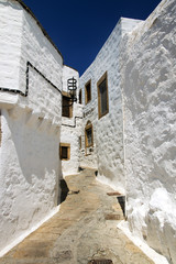 A view of streets and ancient houses in the island of Patmos, Greece in summer time