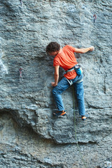 rock climber climbing on the cliff