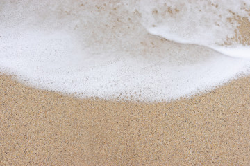 Sand and sea wash