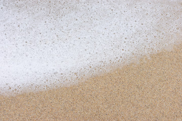 Sand and sea wash