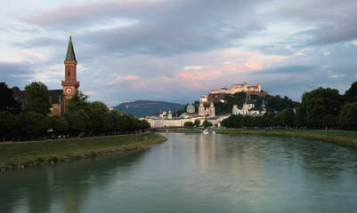 River Salzach with Christ church (Christuskirche) on the left and Hohensalzburg Fortress on the right. Salzburg, Austria. 