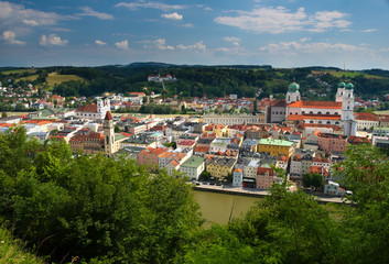 Overlooking city center of Passau. Confluence of rivers Donau and Inn. Dominant landmarks - St. Stephan's Cathedral (Dom St. Stephan) and city town hall (Altes Rathaus)