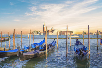 Fototapeta premium Beautiful view of the gondolas and the Cathedral of San Giorgio Maggiore, on an island in the Venetian lagoon, Venice, Italy