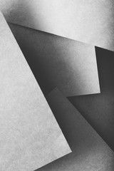 paper layers. abstract geometric background with copy space. grey color shades.