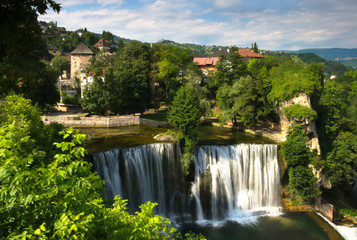 A beautiful view at Pliva waterfall (Plivski vodopad) located in the city center of Jajce, Bosnia and Herzegovina.