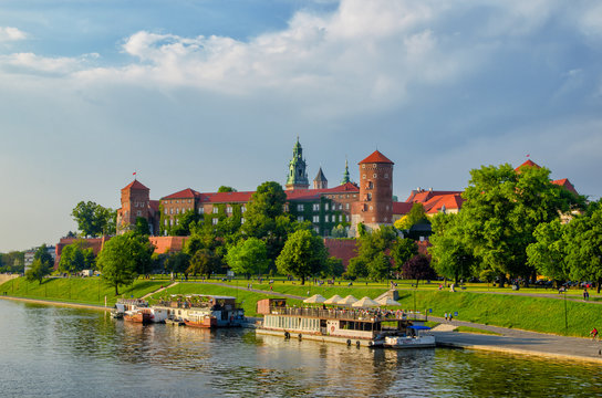Wawel castle famous landmark in Krakow Poland. River Wisla view. Summer or spring green landscape