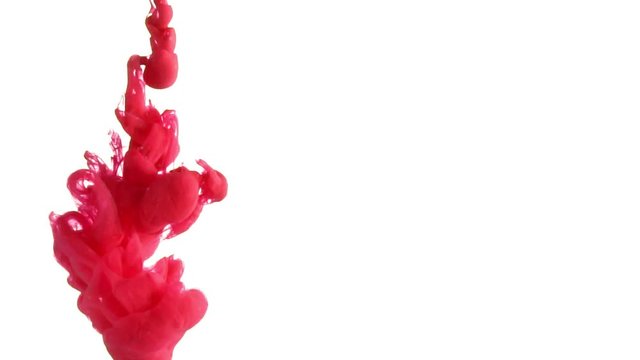 Red ink splash in water slow motion on white