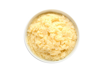 Bowl with mashed potatoes on white background, top view