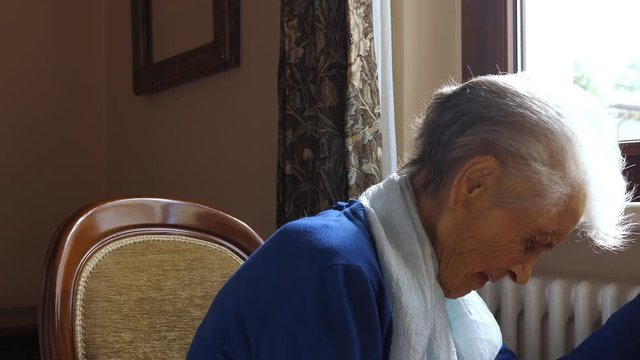 Old caucasian woman with heart attack, chest pain. Loneliness and abandonment concept