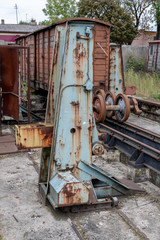 Fototapeta na wymiar Old workshop of wagons and narrow-gauge railway locomotives. Place of repair and renovation for trains.