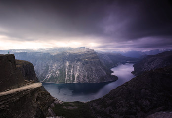 Panoramic view of norway landmark trolltunga, with fjord, lake and cloud sky. Tourism concept
