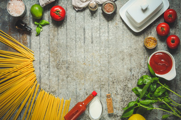 pasta raw and vegetables (spaghetti). a set of ingredients for cooking. . food background. top view