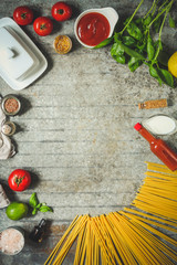 pasta raw and vegetables (spaghetti). a set of ingredients for cooking. . food background. top view