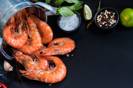 Perfect cooked prawns shrimps with herbs, spices text space