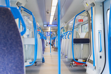 Fototapeta premium Electric train blue sits interior express europe
