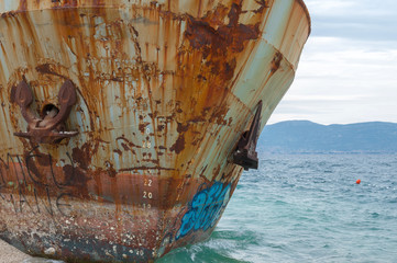 Bow and anchor of shipwreck on a beach. Adriatic Sea.