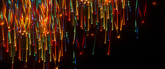 Neon sparks on a dark background. Abstract dark background.