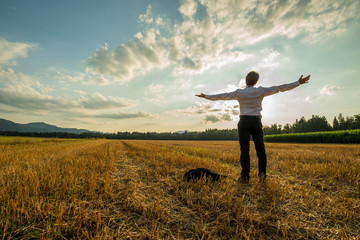 Businessman standing with his arms outstretched - obrazy, fototapety, plakaty