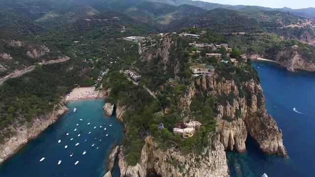 Stunning aerial shot of costa brava rocky coastline and luxury villas. Costa Brava, Tossa de Mar, Cala Pola, Europe, Spain, Catalonia