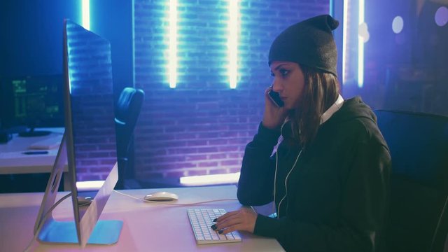 Girl hacker chatting with her criminal partner