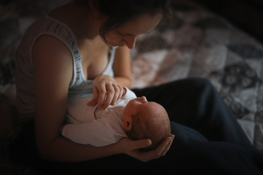 Sweet newborn baby with mother, gentle and cozy