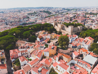 Obraz premium Beautiful super wide-angle aerial view of Lisbon, Portugal with harbor and skyline scenery beyond the city, shot from drone