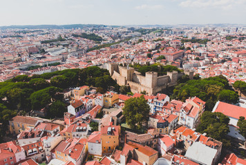 Beautiful super wide-angle aerial view of Lisbon, Portugal with harbor and skyline scenery beyond the city, shot from drone