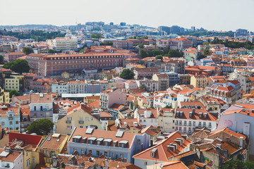 Fototapeta na wymiar Beautiful super wide-angle aerial view of Lisbon, Portugal with harbor and skyline scenery beyond the city, shot from belvedere observation deck