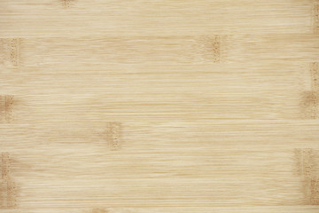 Board made of natural bamboo wood. Textures pattern background in light yellow cream beige brown color.