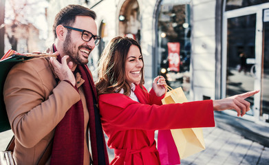 Shopping time. Young couple in shopping. Consumerism, love, dating, lifestyle concept