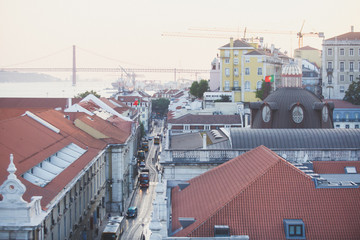 Beautiful super wide-angle aerial view of Lisbon, Portugal with harbor and skyline scenery beyond the city, shot from belvedere observation deck Rua Augusta Triumphal Arch Viewpoint, Commerce Square