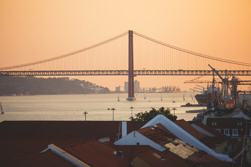 Fototapeta premium Beautiful super wide-angle aerial view of Lisbon, Portugal with harbor and skyline scenery beyond the city, shot from belvedere observation deck Rua Augusta Triumphal Arch Viewpoint, Commerce Square
