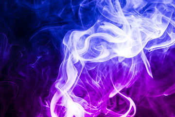 Colored smoke on black background