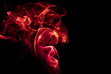 Red smoke on black background