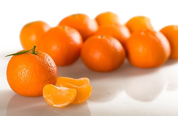 Fresh oranges and wedges