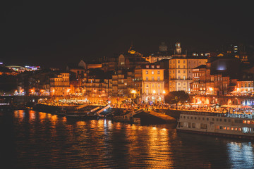 Beautiful super wide-angle panoramic summer aerial view of Old Porto Oporto city and Ribeira Square with the old town, during the sunset over Douro river from Vila Nova de Gaia, Porto, Portugal