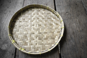 Threshing basket on the wooden floor.