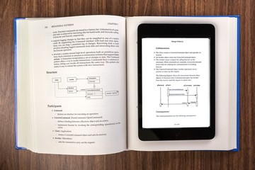 Fototapeta premium Digital Tablet on Open Book