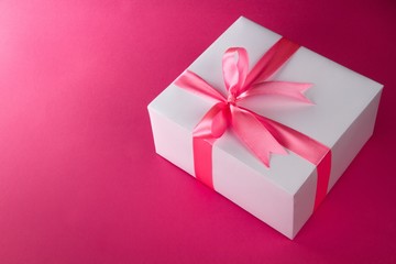 Present wrapped in a pink bow