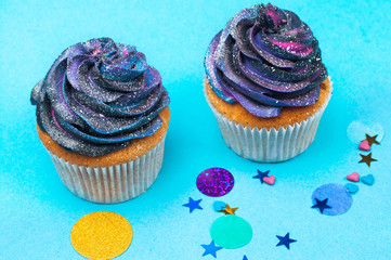 Vanilla cupcakes on party background with copy space