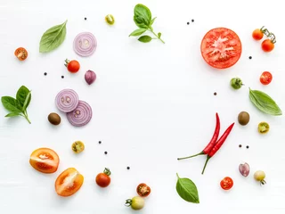  The ingredients for homemade pizza on white wooden background. © kerdkanno