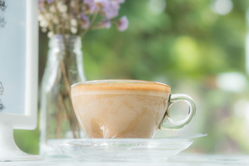 Obraz na płótnie Canvas Cappuccinu coffee in clear cup on table cafe