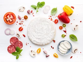 Fotobehang The ingredients for homemade pizza on white wooden background.. © kerdkanno